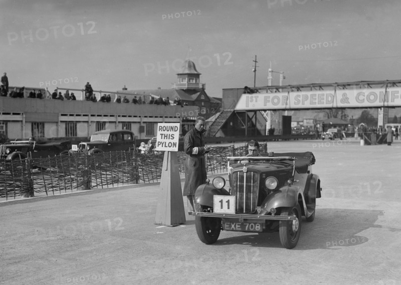 Morris 8 tourer competing in the JCC Rally, Brooklands, Surrey, 1939. Artist: Bill Brunell.