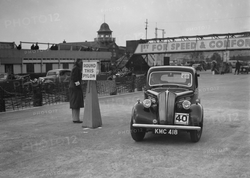 Standard saloon competing in the JCC Rally, Brooklands, Surrey, 1939. Artist: Bill Brunell.