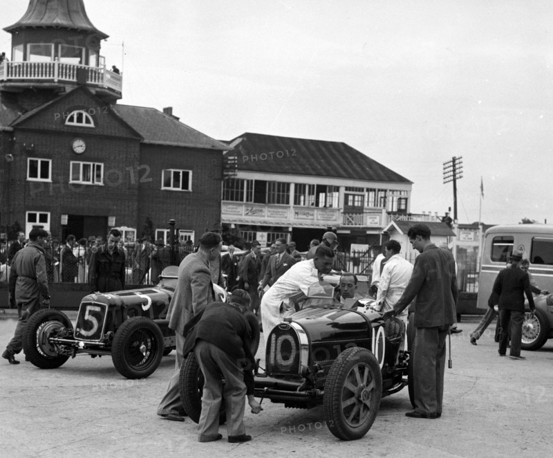 ERA and Charles Mortimer's Bugatti Type 35B at Brooklands, Surrey, 1939. Artist: Bill Brunell.