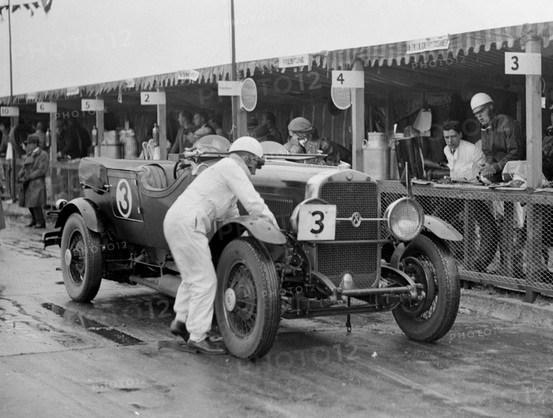 Studebaker of A Hollidge and GAW Laird in the pits at the JCC Double Twelve Race, Brooklands, 1929. Artist: Bill Brunell.