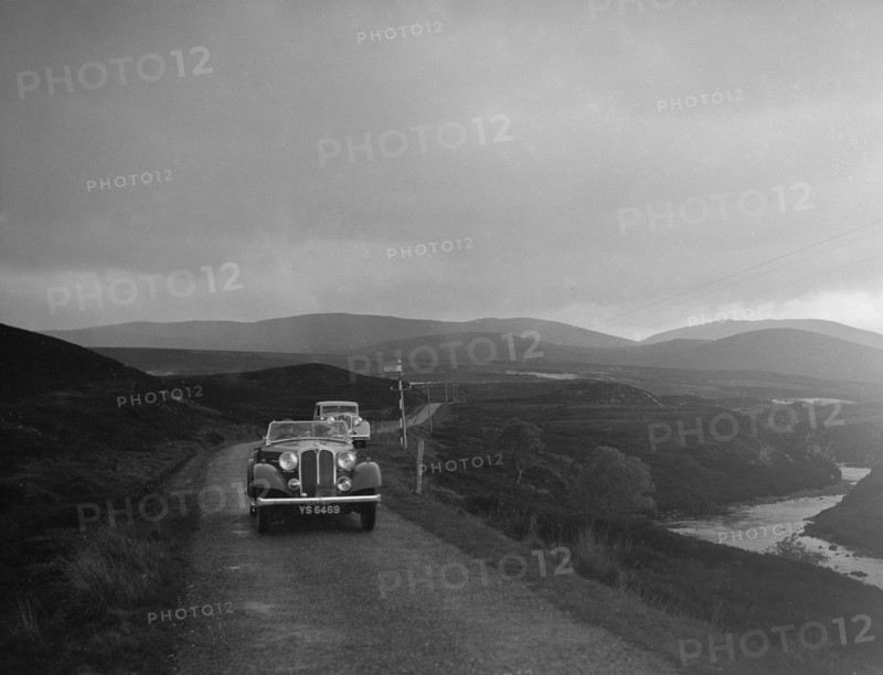 Rover open tourer of HE Gibbon competing in the RSAC Scottish Rally, 1936. Artist: Bill Brunell.
