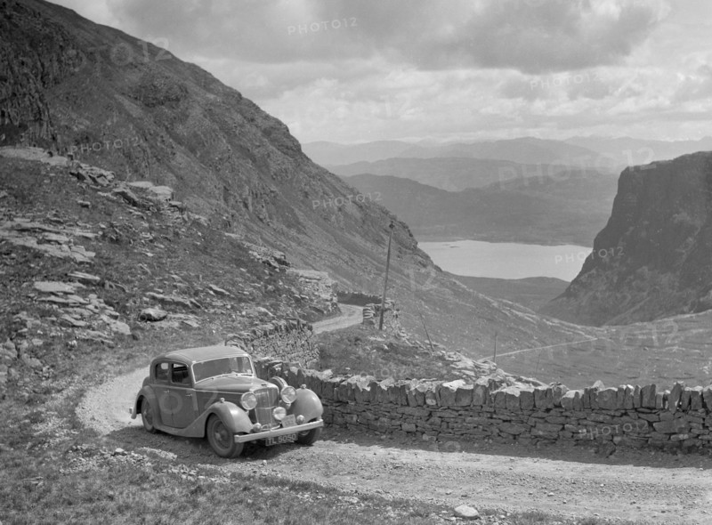 SS Jaguar of CL Bembridge competing in the RSAC Scottish Rally, 1936. Artist: Bill Brunell.