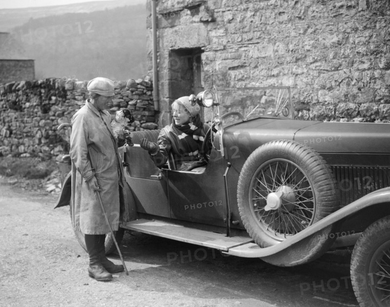 Kitty Brunell in a MG 18/80 open 4-seater, c1930(?). Artist: Bill Brunell.