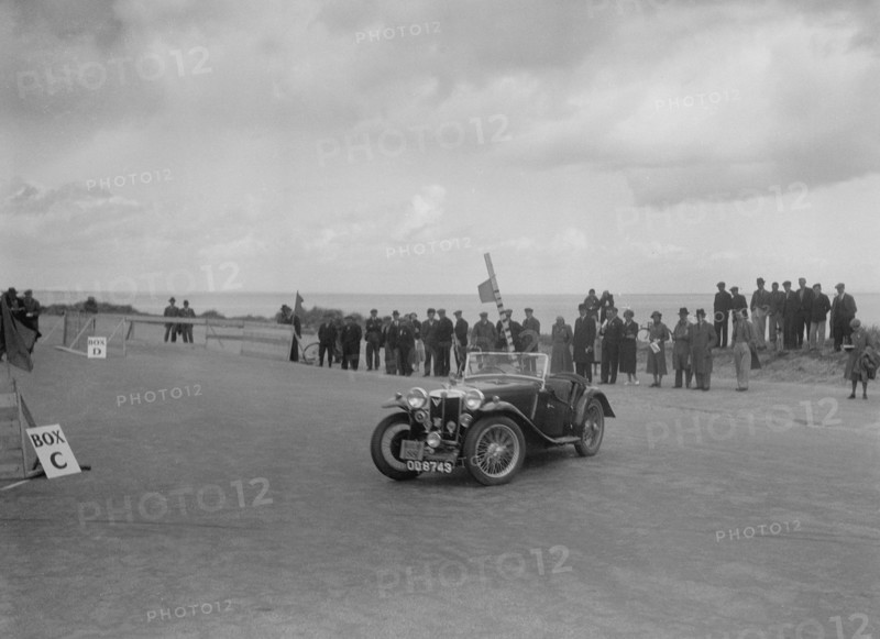 MG PA of Miss E Violet Watson competing in the RSAC Scottish Rally, 1934. Artist: Bill Brunell.