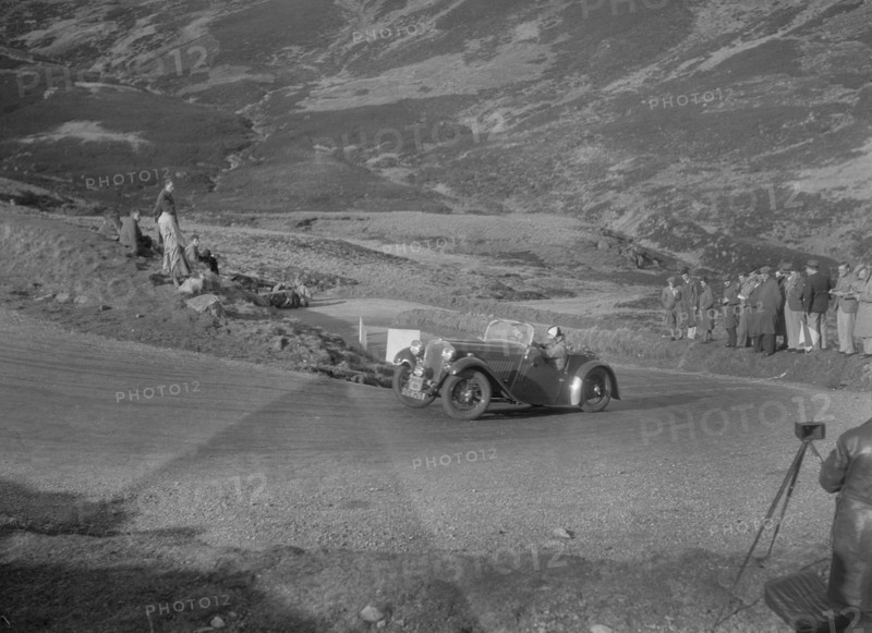 Singer Le Mans 2-seater competing in the RSAC Scottish Rally, Devil's Elbow, Glenshee, 1934. Artist: Bill Brunell.