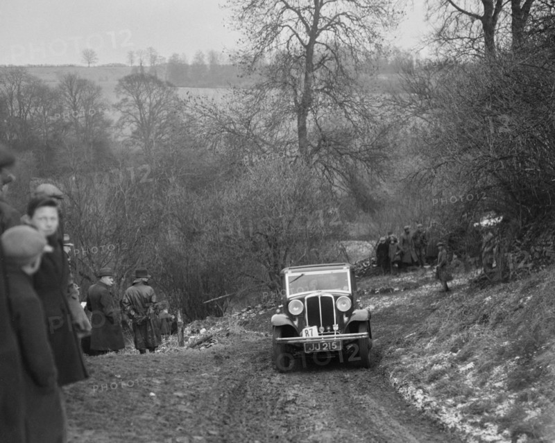 Standard Nine saloon of Mrs M Vaughan competing in the Sunbac Colmore Trial, Gloucestershire, 1933. Artist: Bill Brunell.