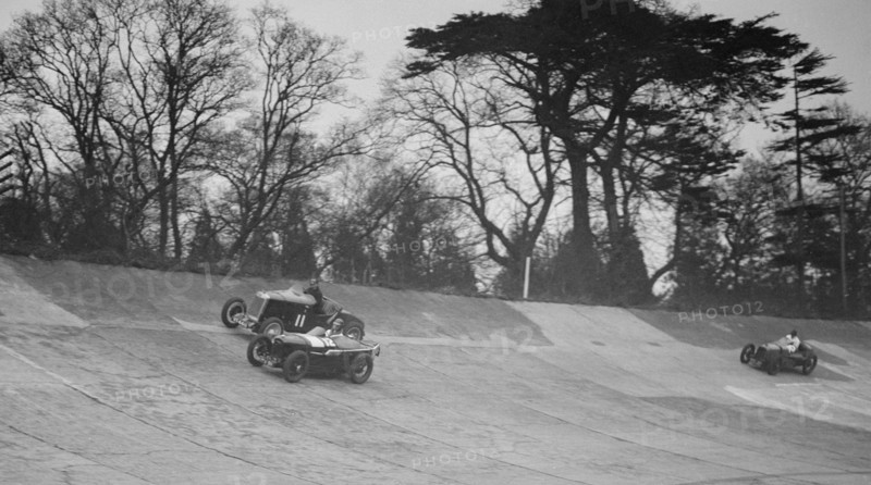 Lea-Francis Hyper of AS Llewellyn and Amilcar of Major A Gardner, BARC meeting, Brooklands, 1930. Artist: Bill Brunell.