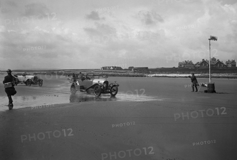 Bentley of ER Insole and Austin of RW Thomas competing in the Porthcawl Speed Trials, Wales, 1922. Artist: Bill Brunell.