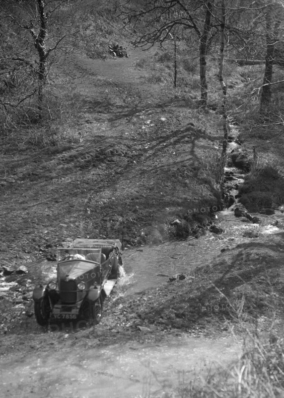 Kitty Brunell road testing a Riley 9 WD tourer, c1930. Artist: Bill Brunell.