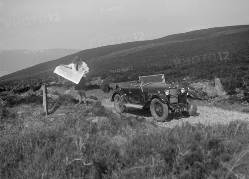Kitty Brunell road testing a Riley 9 WD tourer, c1930. Artist: Bill Brunell.