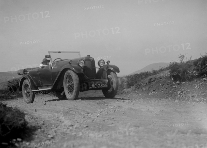 Kitty Brunell road testing a Riley 9 WD tourer, c1930. Artist: Bill Brunell.