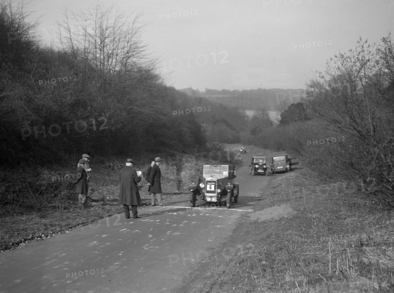 Bayliss-Thomas of WJ Hayward, winner of the JCC Half-Day Trial, Ranmore Common, Surrey, 1930. Artist: Bill Brunell.