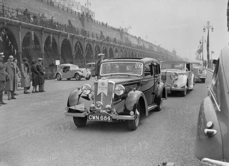 Riley 4-door saloon of AS Bassett at the RAC Rally, Madeira Drive, Brighton, 1939. Artist: Bill Brunell.