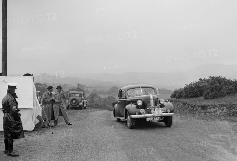 Pontiac saloon of J Owen-Smith competing in the South Wales Auto Club Welsh Rally, 1937 Artist: Bill Brunell.