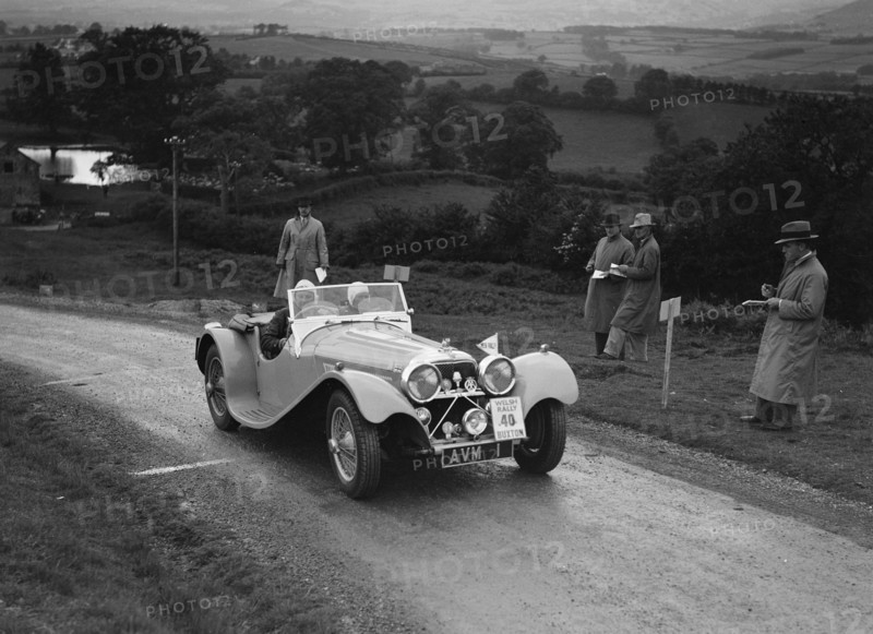 Jaguar SS 100 of Mrs V Hetherington competing in the South Wales Auto Club Welsh Rally, 1937 Artist: Bill Brunell.