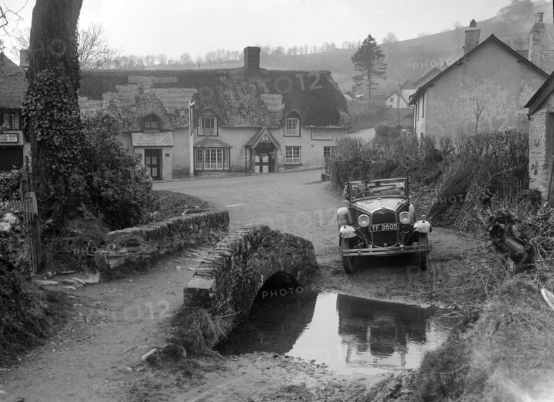 Kitty Brunell driving a Ford Model A 2-seater, Winsford, Somerset, 1930s. Artist: Bill Brunell.