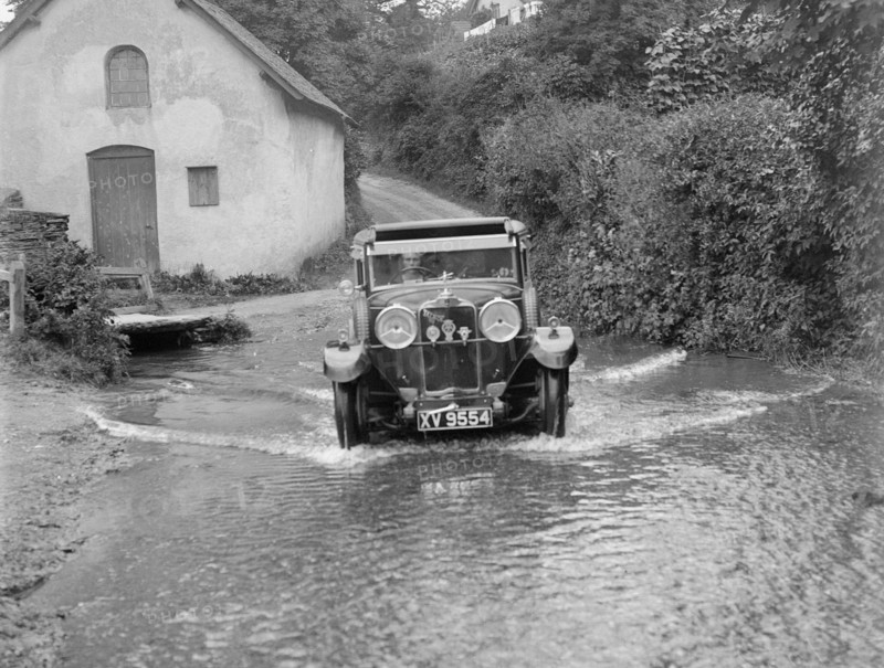 Kitty Brunell fording the River Exe in a Talbot 14/45 sportsman's coupe, Winsfors, Somerset, c1930s. Artist: Bill Brunell.