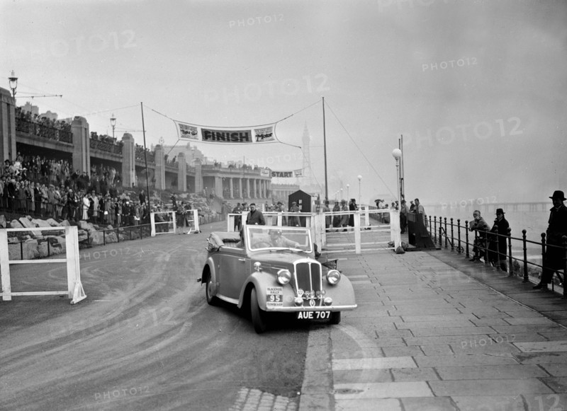 Standard Avon Twelve competing in the Blackpool Rally, 1936. Artist: Bill Brunell.