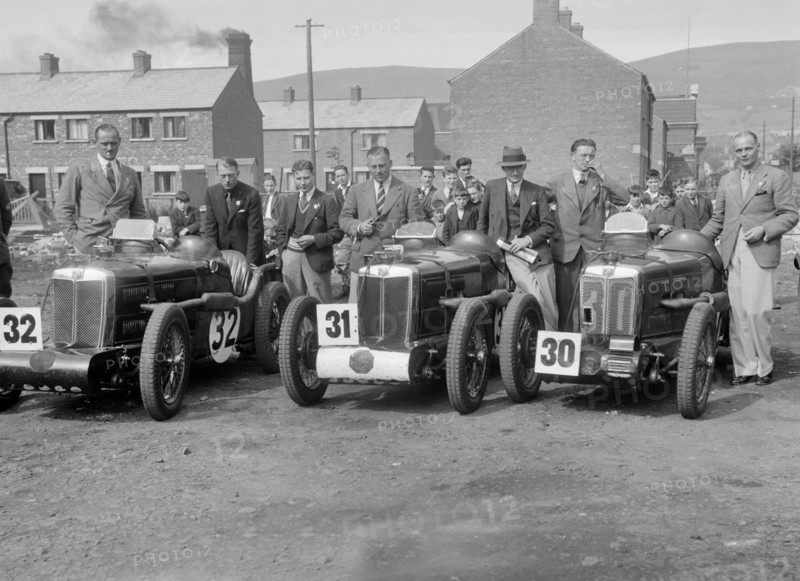 Three MG C type Midgets at the RAC TT Race, Ards Circuit, Belfast, 1932. Artist: Bill Brunell.