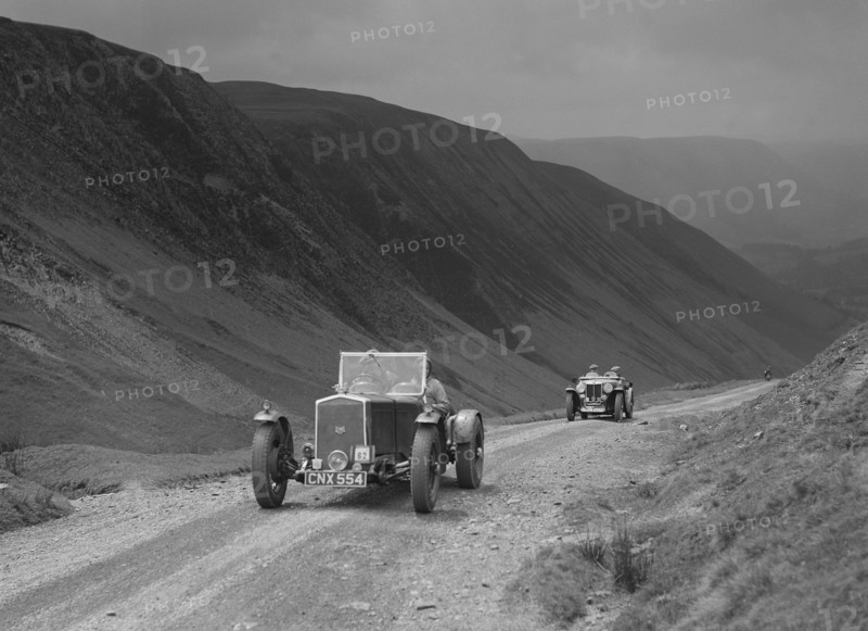 Wolseley and MG NA competing in the MG Car Club Abingdon Trial/Rally, 1939. Artist: Bill Brunell.