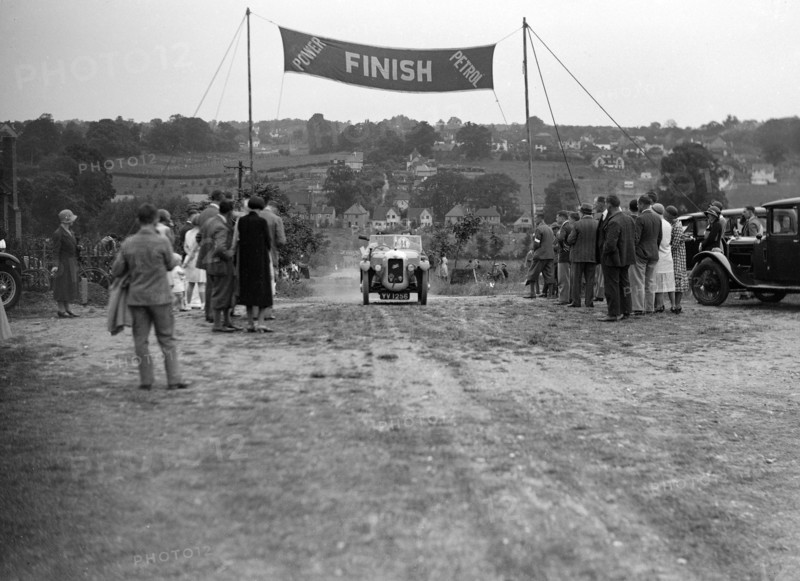 Austin Swallow of Mrs A Stanley at the finish of the Middlesex County AC Hill Climb, c1930. Artist: Bill Brunell.
