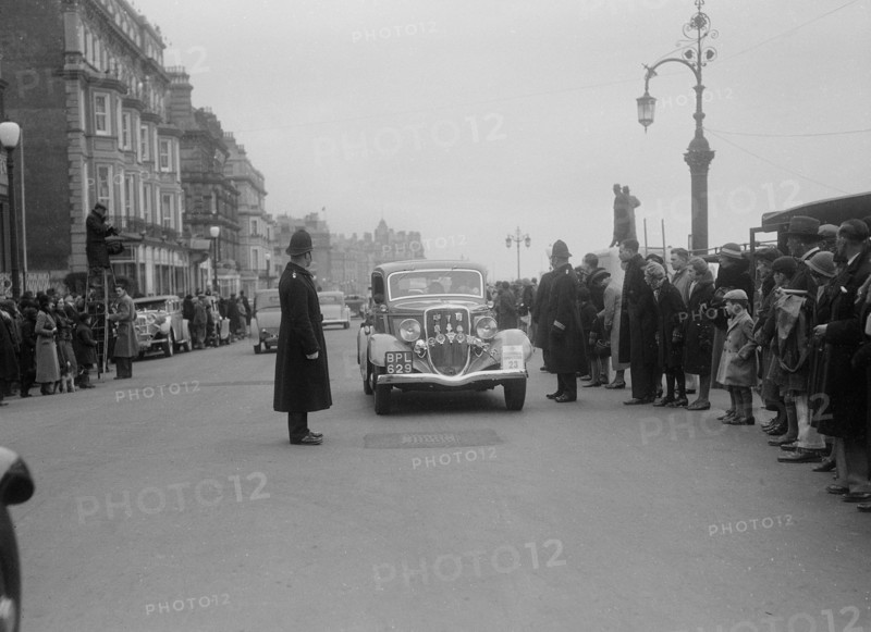 Ford V8 of K Hutchison at the RAC Rally, 1935. Artist: Bill Brunell.