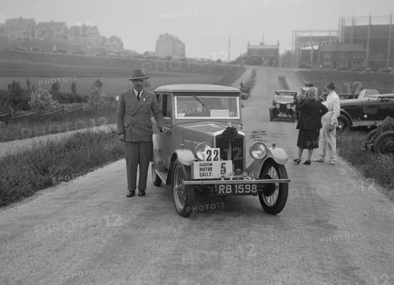 Wolseley Hornet saloon of DEM Douglas-Morris at the B&HMC Brighton Motor Rally, 1930. Artist: Bill Brunell.