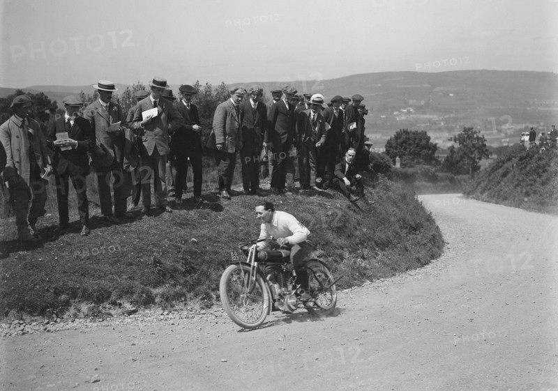 Motorcycle competing in the South Wales Auto Club Caerphilly Hillclimb, Wales, pre 1915.   Artist: Bill Brunell.