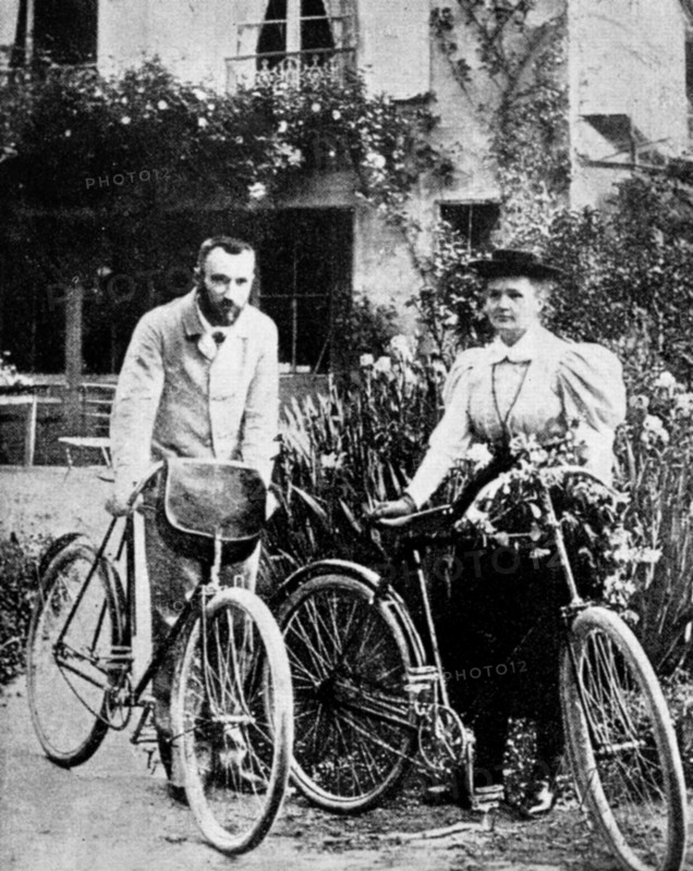 Pierre and Marie Curie, French physicists, preparing to go cycling. Artist: Unknown