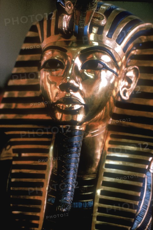 Gold mask of Tutankhamun on his mummy-case. Artist: Unknown
