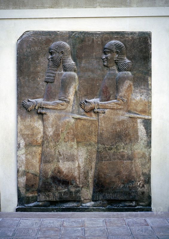 Assyrian relief of two servants, Palace of Sargon II, Khorsabad, c8th century BC. Artist: Unknown