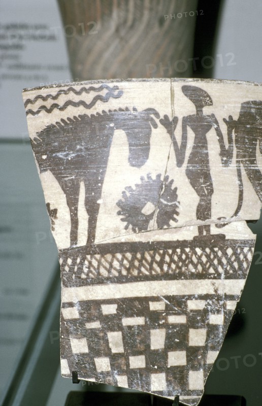 Terracotta pottery fragment of a human figure between two horses, Tepe Sialk, Iran, 4th mil. BC. Artist: Unknown
