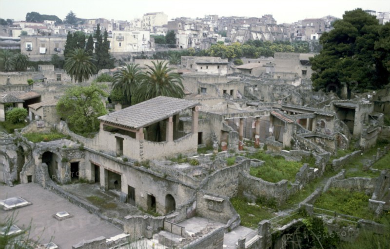 Buildings of Herculaneum with houses of the modern town of Ercolano above, Italy. Artist: Unknown