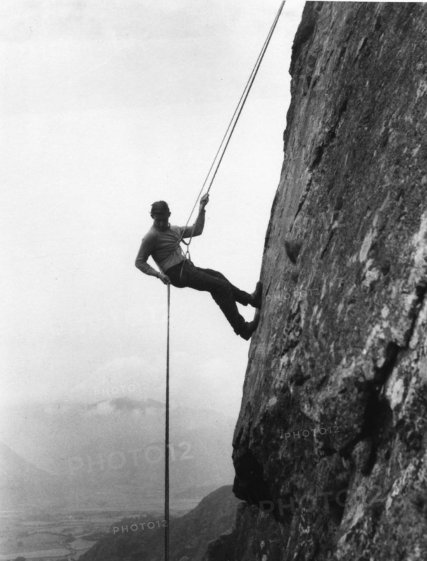 Boy abseiling down rock face, Outward Bound School, Eskdale, Cumbria, 1950. Artist: Unknown