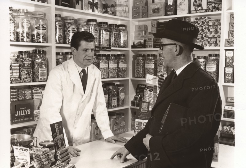 A salesman talking to a shopkeeper, 1956. Artist: Unknown