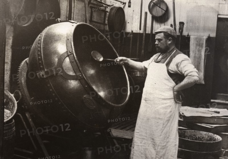 A man in an apron panning chocolate, Rowntree Cocoa Works, York, Yorkshire, 1900. Artist: Unknown