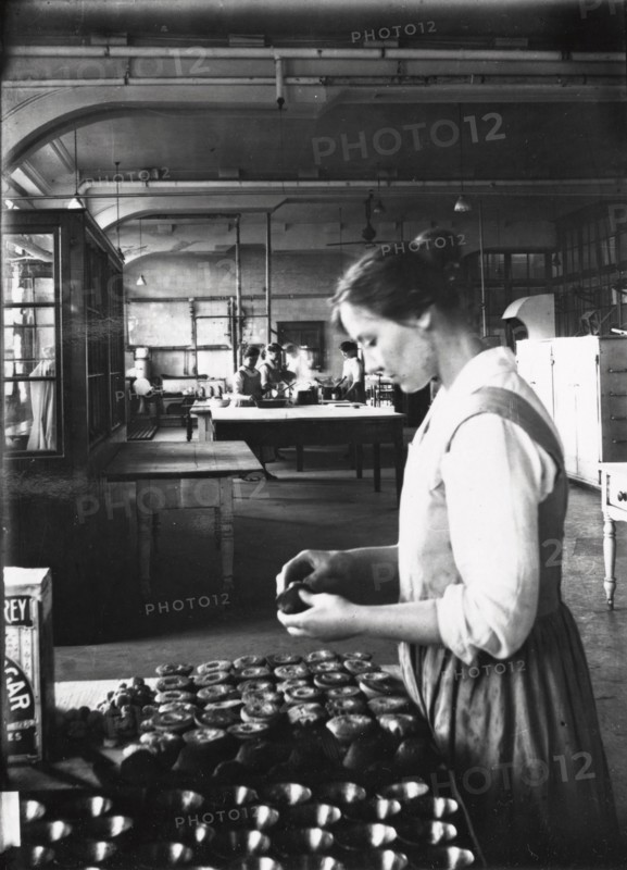 A cook makes pastry in the factory kitchens, Rowntree?s factory, York, Yorkshire, 1913. Artist: Unknown