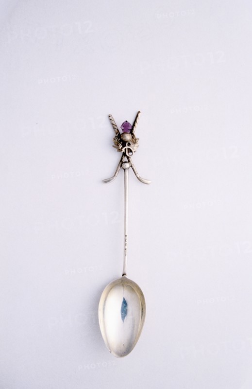 Silver spoon with crossed golf club motif, British, c1920s. Artist: Unknown