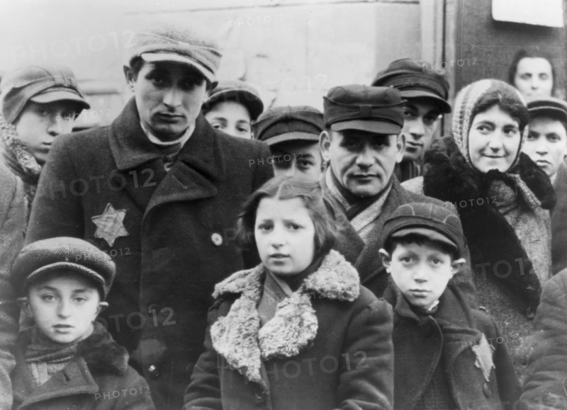 Jews wearing Star of David badges, Lodz Ghetto, Poland, 1940-1944. Artist: Unknown