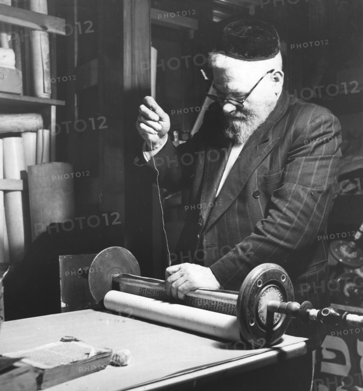 Sewing together completed sections of a Sefer Torah, 1974. Artist: Unknown