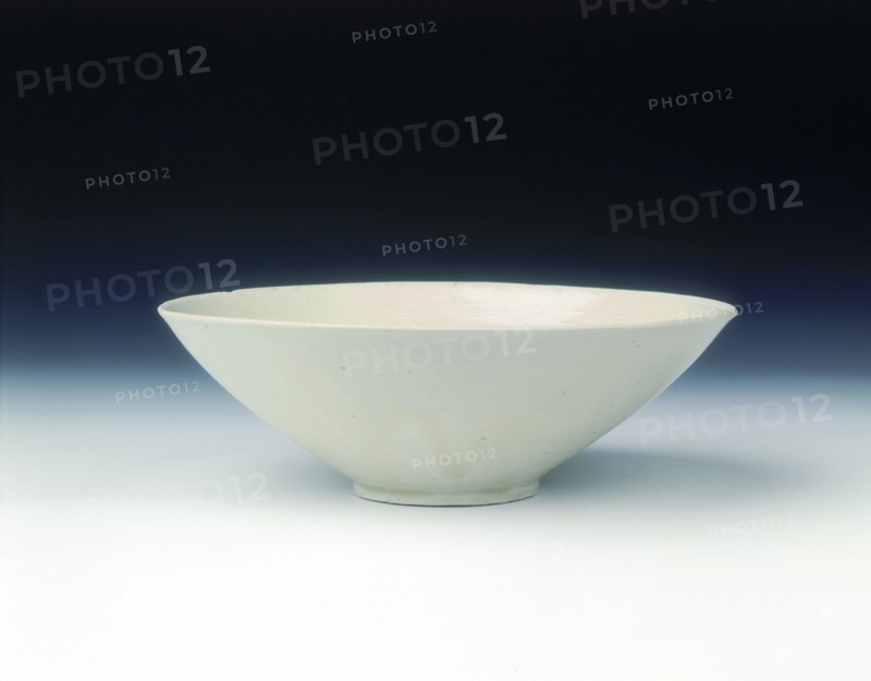 White ware bowl with moulded twin fish and floral pattern, Jin dynasty, China, 12th century. Artist: Unknown