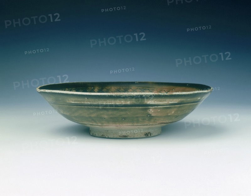 Stoneware bowl with moulded peony scroll and lions, Jin dynasty, China, 13th century. Artist: Unknown