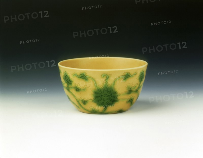 Yellow cup with lotus scrolls in green enamel, Yongzheng period, Qing dynasty, China, 1723-1735. Artist: Unknown