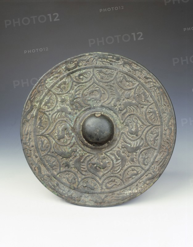 Bronze mirror with dragon and phoenix design, early Six Dynasties period, China, mid 3rd century. Artist: Unknown