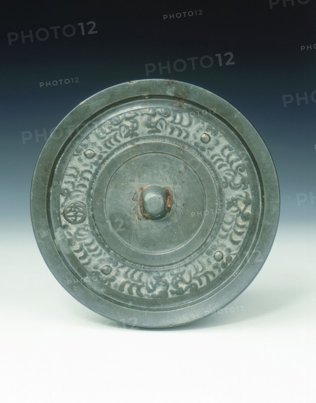 Bronze mirror with multi-armed Avalokitesvara and characters, Yuan dynasty, China, 1271-1368. Artist: Unknown