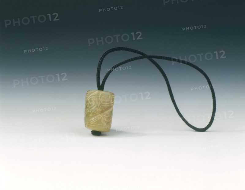 Jade bead with spiralling decoration, Western Zhou dynasty, China, c1100-771 BC. Artist: Unknown