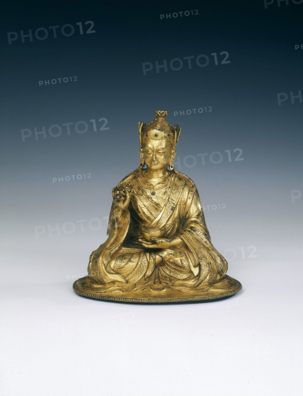 Gilt brass Padmasambhava holding attributes, Tibet, 16th-17th century. Artist: Unknown