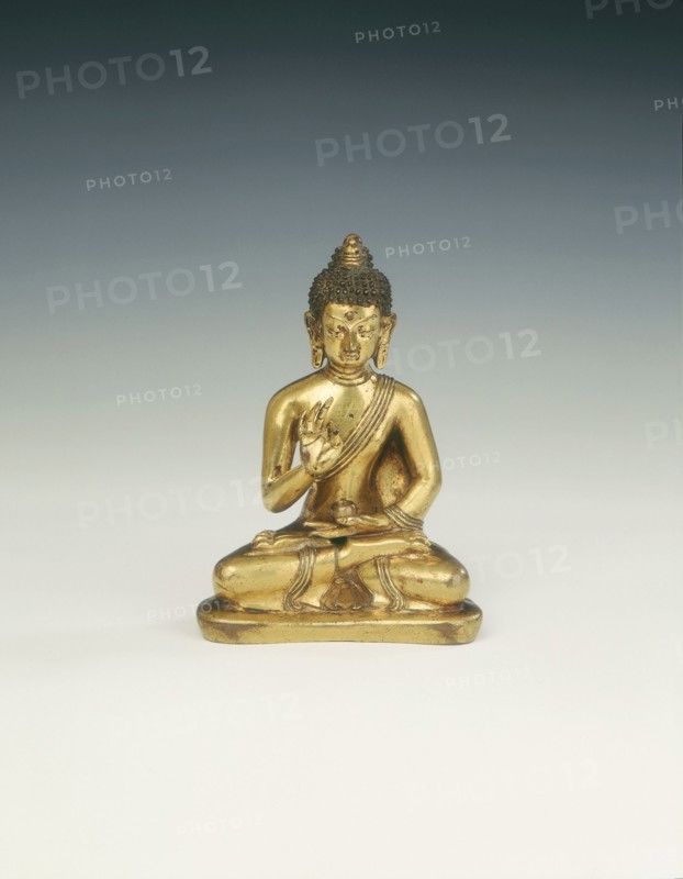 Gilt brass Amoghasiddhi, Buddha of infallible magic, Mongolia, 18th century. Artist: Unknown