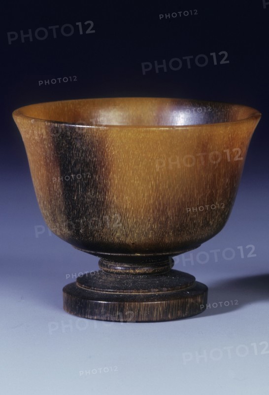 Plain circular rhino horn cup with turned stepped foot and stem, Qing dynasty, China, 18th century. Artist: Unknown