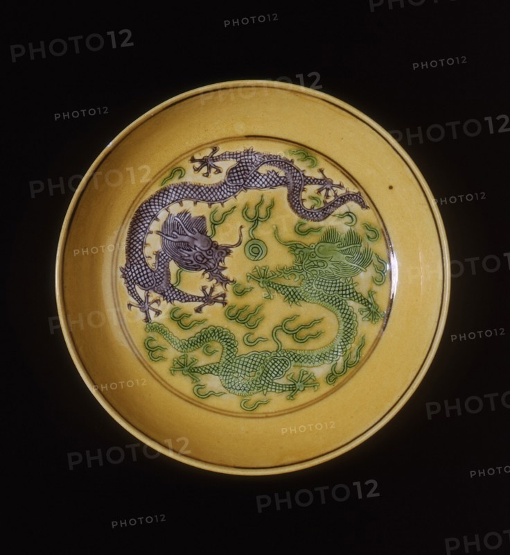 Green and aubergine dragons on yellow ground saucer, Guangxu period, Qing dynasty, China, 1875-1908. Artist: Unknown